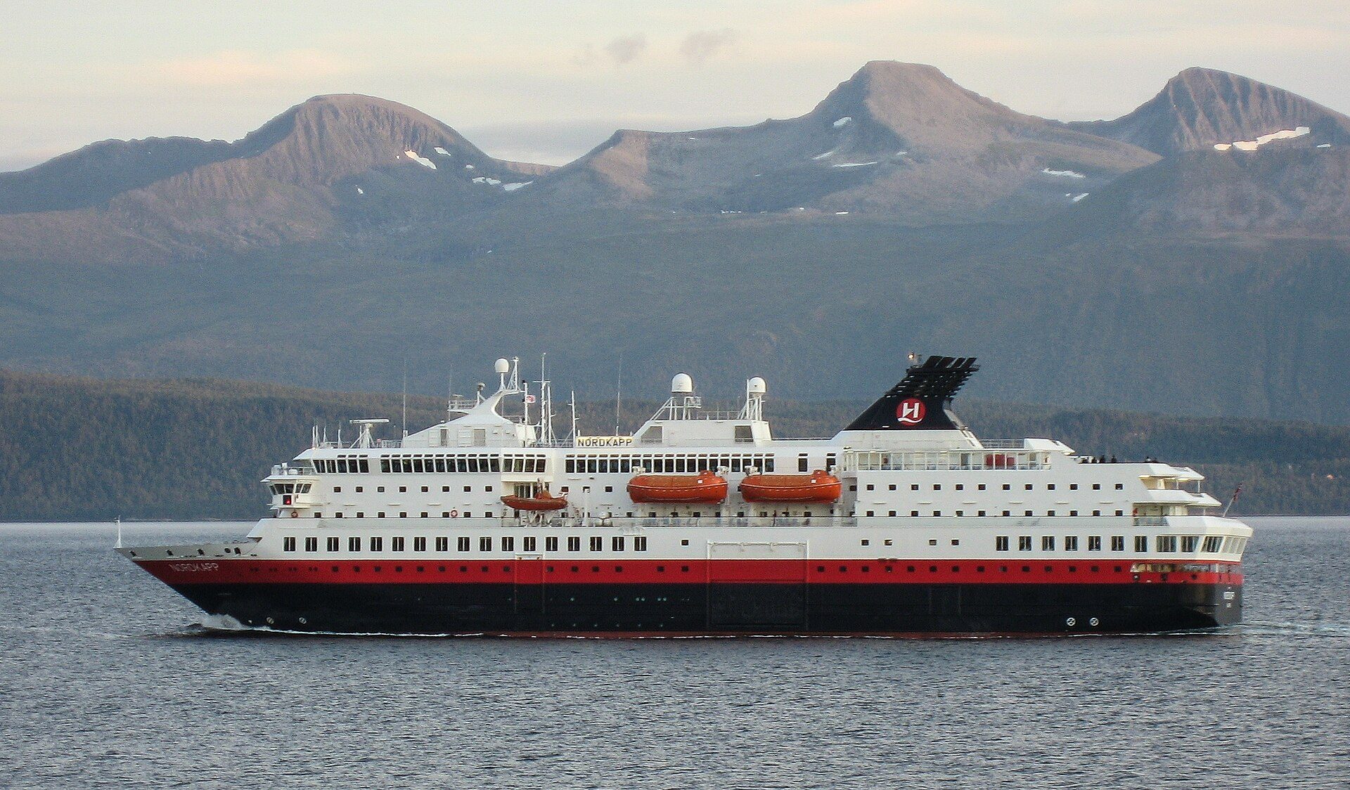 A coastal ferry under way in a Norwegian fjord